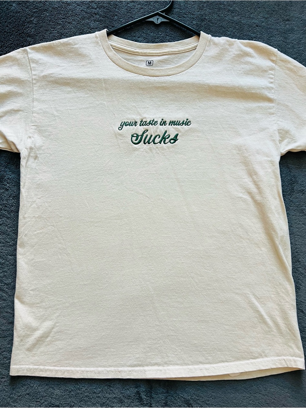 Cream Graphic Tee "your taste in music Sucks"